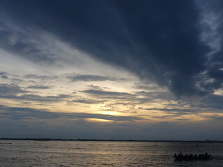 Sunset on the river. A beautiful reflection of the sun