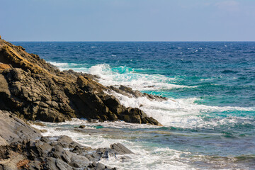 Rocks and blue sea at the northeast coast of Menorca island. Cape of Favaritx. Baleares, Spain
