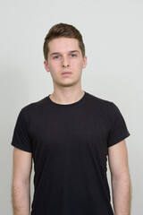 Obraz premium Portrait of young handsome man against white background