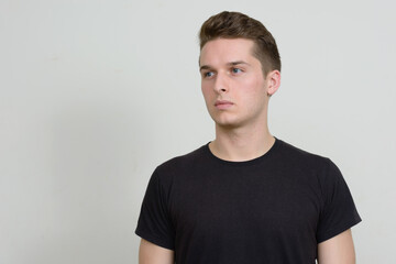 Obraz premium Portrait of young handsome man against white background