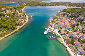 Naklejka na ściany i meble Town of Veli Rat on Dugi Otok island on Adriatic sea in Croatia, aerial view from drone, beautiful seascape