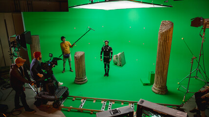 In the Big Film Studio Professional Crew Shooting Blockbuster Movie. Director Commands Cameraman to...