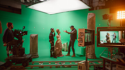On Big Film Studio Professional Crew Shooting Period Costume Drama Movie. On Set: Director Explains...