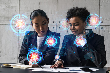 Two businesswomen work together in modern office on new project. Double exposure. Concept of...