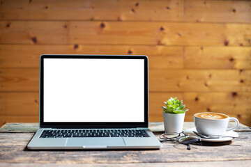 Fototapeta premium mockup empty screen computer on wood desk in cafe