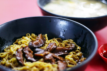 Asian Street Food - Mushroom Minced Pork Noodles served dry or in broth, close up