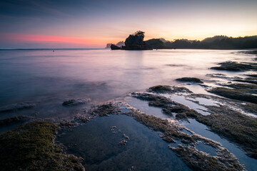 sunset and silhouette of kondang merak beach