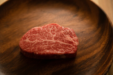 Beef fillet steak on the wooden plate