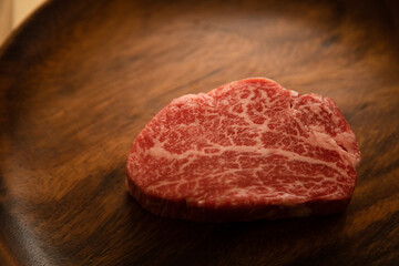 Beef fillet steak on the wooden plate