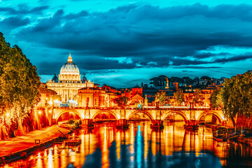 View on Bridge Vittorio Emanuele II (Ponte Vittorio Emanuele II) and Vatican city St. Peter's Basilica (Basilica di San Pietro) at night time. Rome. Italy.