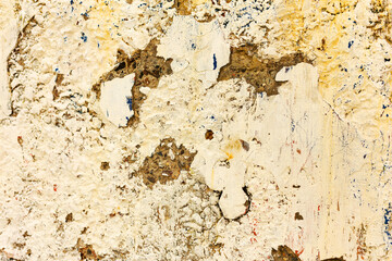Great colorful background or texture. Abstract concrete is aged with cracks, scratches and remnants of old paint in different shades. Rough concrete surface