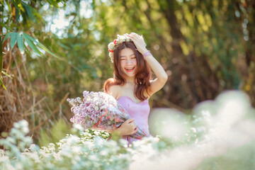 Beautyful Asian woman in the flower garden