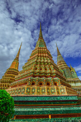 background of important religious attractions in Bangkok (Wat Phra Chetuphon (Wat Pho - reclining Buddha), a large pagoda and beautiful sculptural art give future generations to explore its history