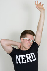 Portrait of young handsome nerd man with eyeglasses