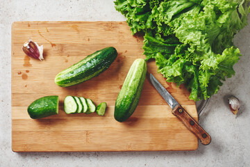 Fresh vegetables on a cutting board, salad ingredients.