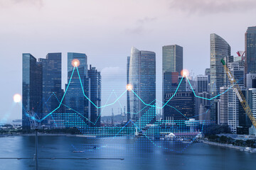 Financial stock chart hologram over panorama city view of Singapore, business center in Asia. The...