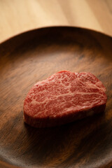 Beef fillet steak on the wooden plate