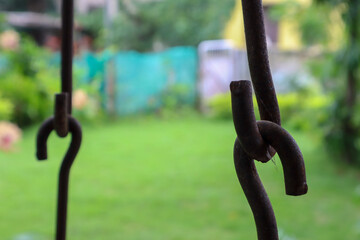 Rusted metallic chains holding together. Swing metal chain Links closeup.