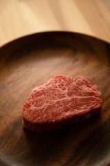 Beef fillet steak on the wooden plate