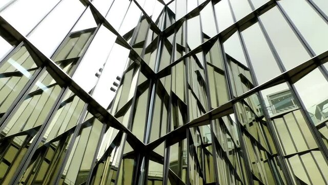Glass architectural color skyscraper. Modern building with blue glassware walls.