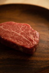 Beef fillet steak on the wooden plate