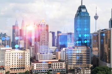 World planet Earth map hologram over panorama city view of Kuala Lumpur, Malaysia, Asia. The concept of international connections and business. Multi Exposure.