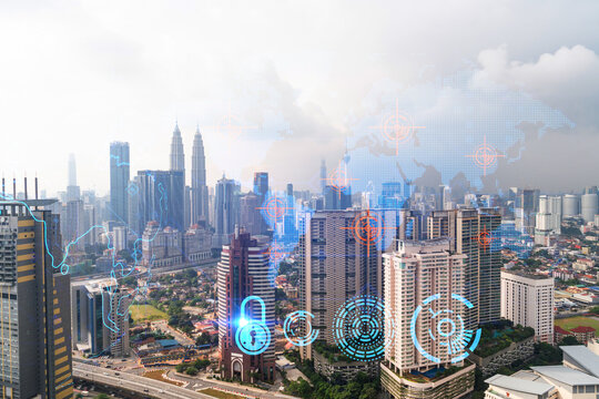 World planet Earth map hologram over panorama city view of Kuala Lumpur, Malaysia, Asia. The concept of international connections and business. Multi Exposure.