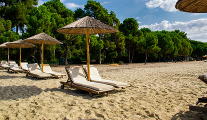 sunbeds and umbrellas on Koukounaries beach, Skiathos, Greece