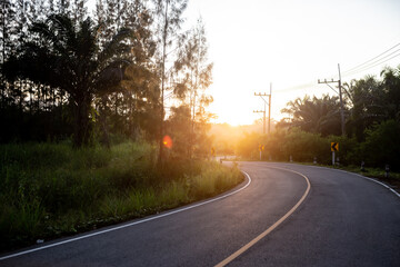 Fototapeta na wymiar Sunrise at the local road.