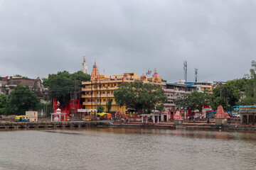 Ujjain, India - August 8th 2020: Ram ghat on shipra river with ancient building and temples on the shore