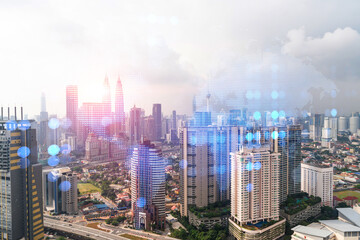 World planet Earth map hologram over panorama city view of Kuala Lumpur, Malaysia, Asia. The concept of international connections and business. Multi Exposure.