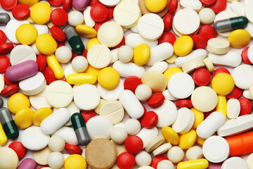 Different colorful tablets at white background