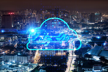 Information cloud hologram, aerial panoramic cityscape of Kuala Lumpur at night. The concept of secure storing digital data in KL, in Malaysia, Asia. Multi exposure.