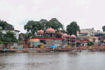 Ujjain, India - August 8th 2020: Ram ghat on shipra river with temples on the shore