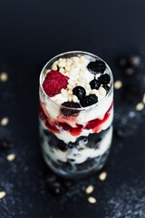 Dessert with raspberry, currant, ice cream and pine nuts