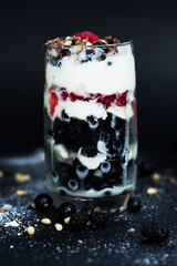 Ice cream, raspberry, currant and pine nuts in dessert