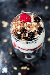 Raspberry, currant, ice cream, chocolate and nuts in sweet dessert