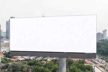 Blank white road billboard with KL cityscape background at day time. Street advertising poster, mock up, 3D rendering. Front view. The concept of marketing communication to promote or sell idea.