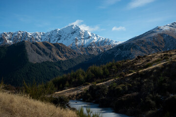 View of the mountain and frozen stream in winter from the Queenstown Hill walkway track