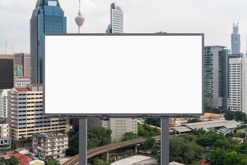 Blank white road billboard with KL cityscape background at day time. Street advertising poster, mock up, 3D rendering. Front view. The concept of marketing communication to promote or sell idea.