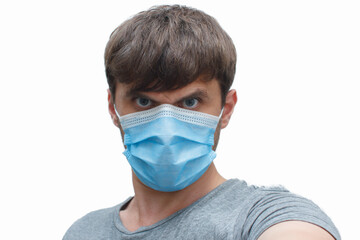 the man in the mask-protection from the coronavirus. a man wears a protective face mask at home. Stop the virus and epidemic diseases.