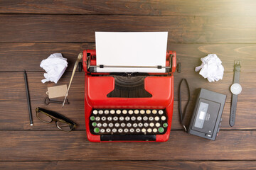 Journalism or blogging concept vintage typewriter on the wooden desk, top view