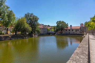 Fototapeta na wymiar View at the Viseu city downtown, with the Paiva river , classic buildings and Church of Mercy on top