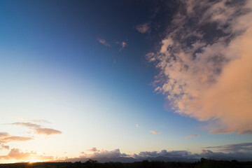 Obraz premium Stunning daybreak mountainscape and skyscape of the Snowdonia Mountain Range from the Isle of Anglesey, North Wales 