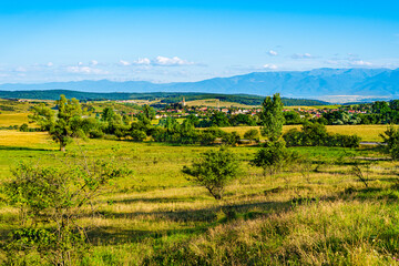 Fototapeta na wymiar Beautiful countryside landscape of Cincu village, Brasov County, Transylvania region, Romania. Traditional transylvanian saxon village with fortified church