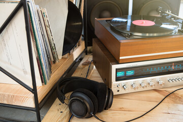 HiFi system with turntable, amplifier, headphones and lp vinyl records in a listening room
