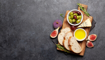 Ripe olives, figs, olive oil and ciabatta bread