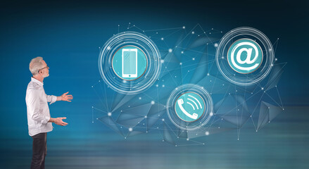 A contact concept explained by a businessman on a wall screen