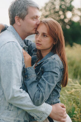 A girl and a man in love in a field of rye