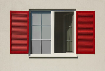 Fototapeta premium Wall of light building with beautiful window and red shutters